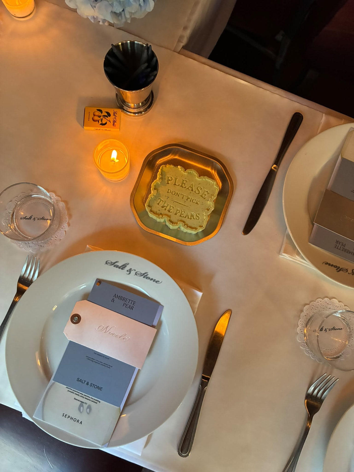 Personalized event place setting by candlelight at TASHCA